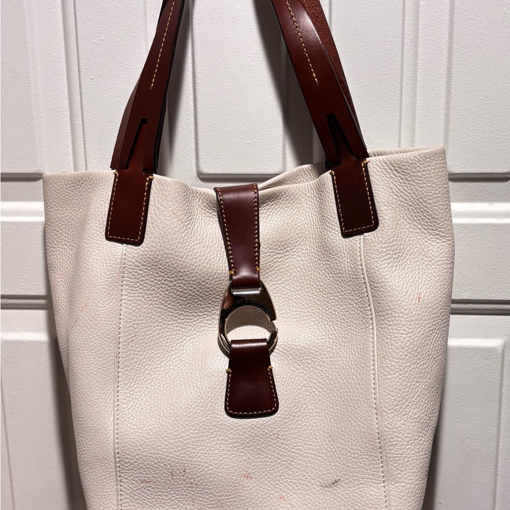 Dooney & Bourke Cream and Brown Tote
Ink marks inside and out!